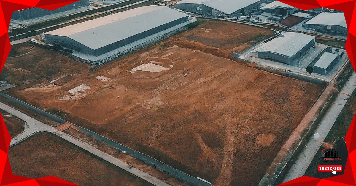 An Aerial View Of Logistics Parks And Industrial Land In Malaysia, Showcasing Warehouses And Transport Facilities.